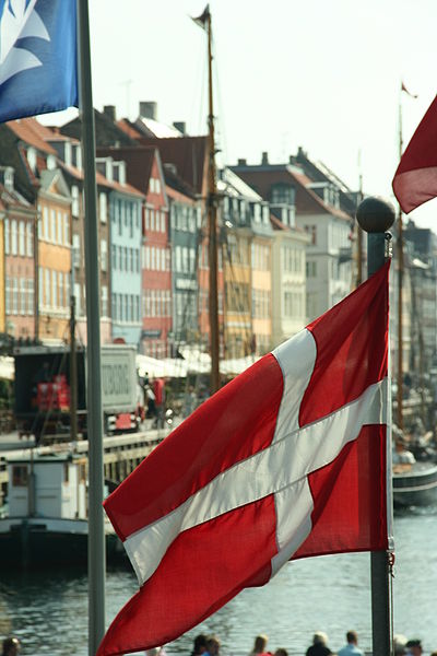 Flag of Denmark in front of Nyhavn, Copenhagen, Denmark. Photographed by Niels Bosboom.